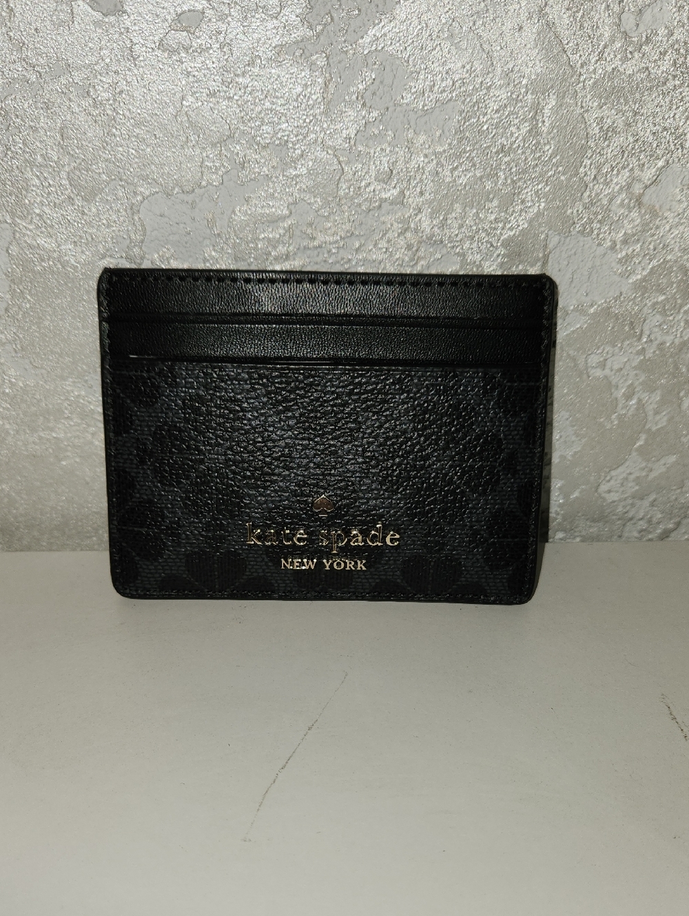 kate spade black textured card case with gold logo
